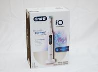 Oral B IO Electric Toothbrush - Ultimate Clean Brush Head, and a travel case. It has 5 Smart Modes for personalized brushing as well as pressure display