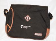 1 Messenger Bag model Messenger College Serena by WillLand Outdoors (WillLandoutdoors.com) with Lambton College Logo. 
Includes laptop compartment. Raised Laptop Sleave. 
Weather Proof
Durable
Lifetime Warranty
